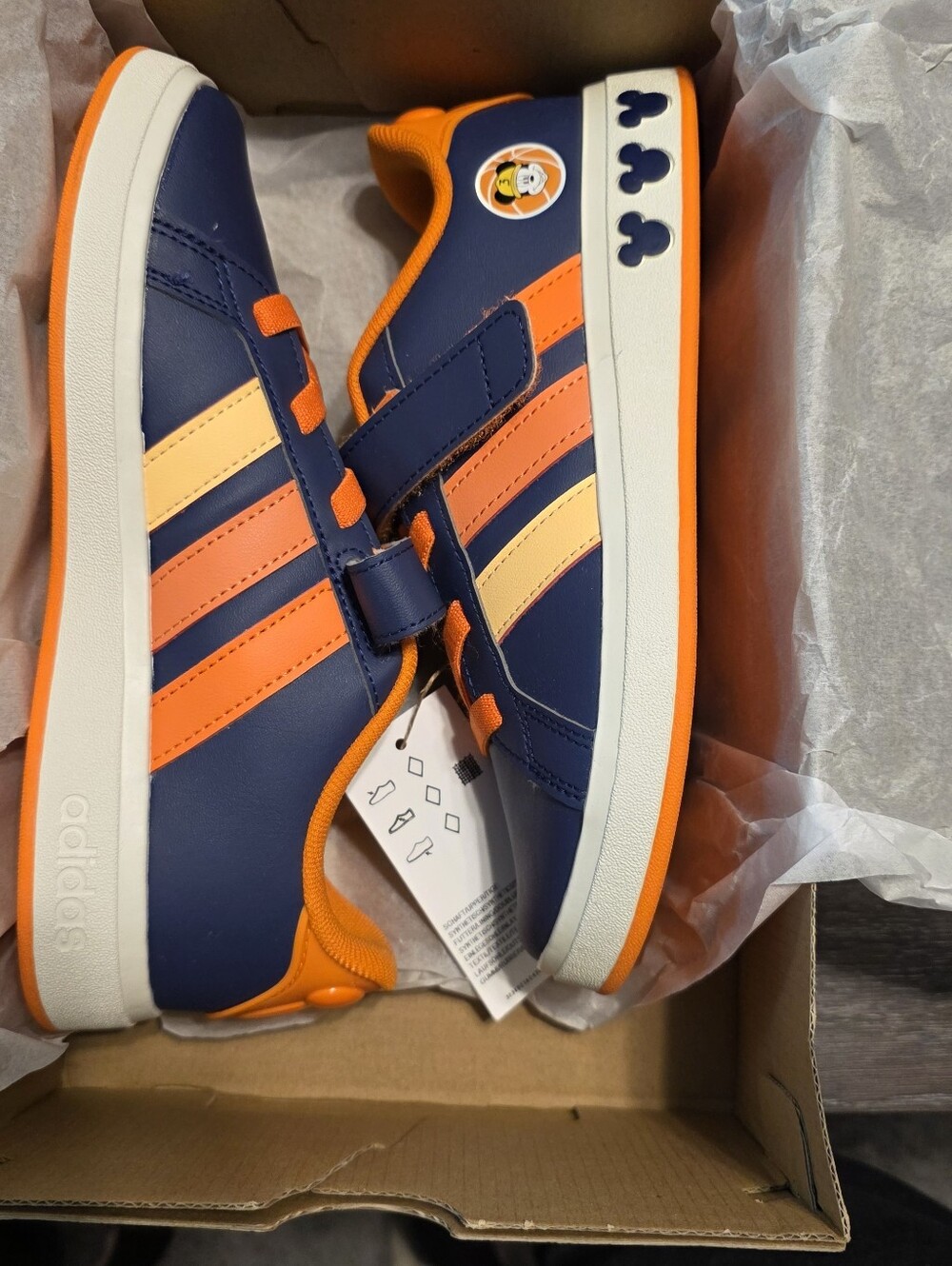 Adidas Grand Quart Disney Mickey Shoes  In Navy Blue, Orange, And Yellow Colors.